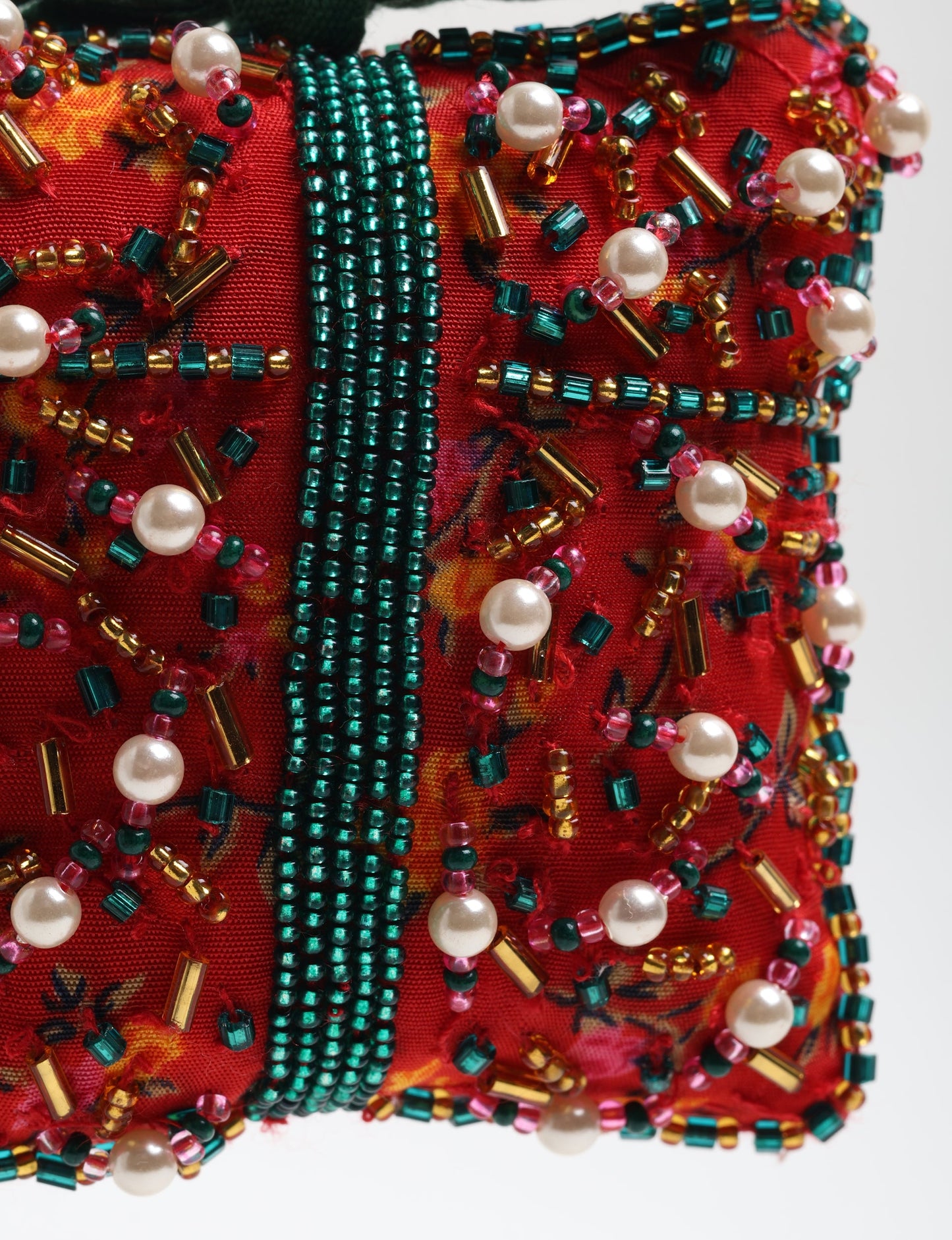 Upcycled bell-shaped Cheer Gift Ornament handmade from recycled sari fabric and decorated with pearls and sequins — an example of eco friendly fashion, recycled clothing, and circular fashion. A festive, earth-friendly decoration from Fair trade fashion and environmentally friendly clothing craftsmanship.