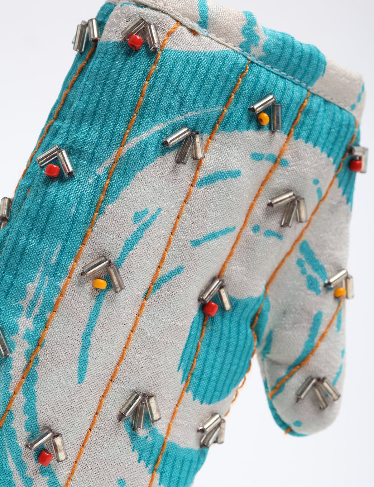 Upcycled Cheer Mitten Ornament handcrafted from recycled sari fabric and organic cotton filling — a cozy example of circular fashion, eco friendly fashion, recycled material clothing, and sustainable women's clothing that celebrates conscious, earth friendly design.