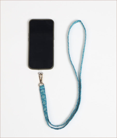 Mobile Phone Lanyard made from recycled sari fabric, featuring repurposed clothing design. Ethical fashion piece promoting eco-friendly fashion, fair trade fashion, and upcycling fashion. Handcrafted by skilled artisans, reflecting recycled material clothing and environmentally friendly clothing trends.