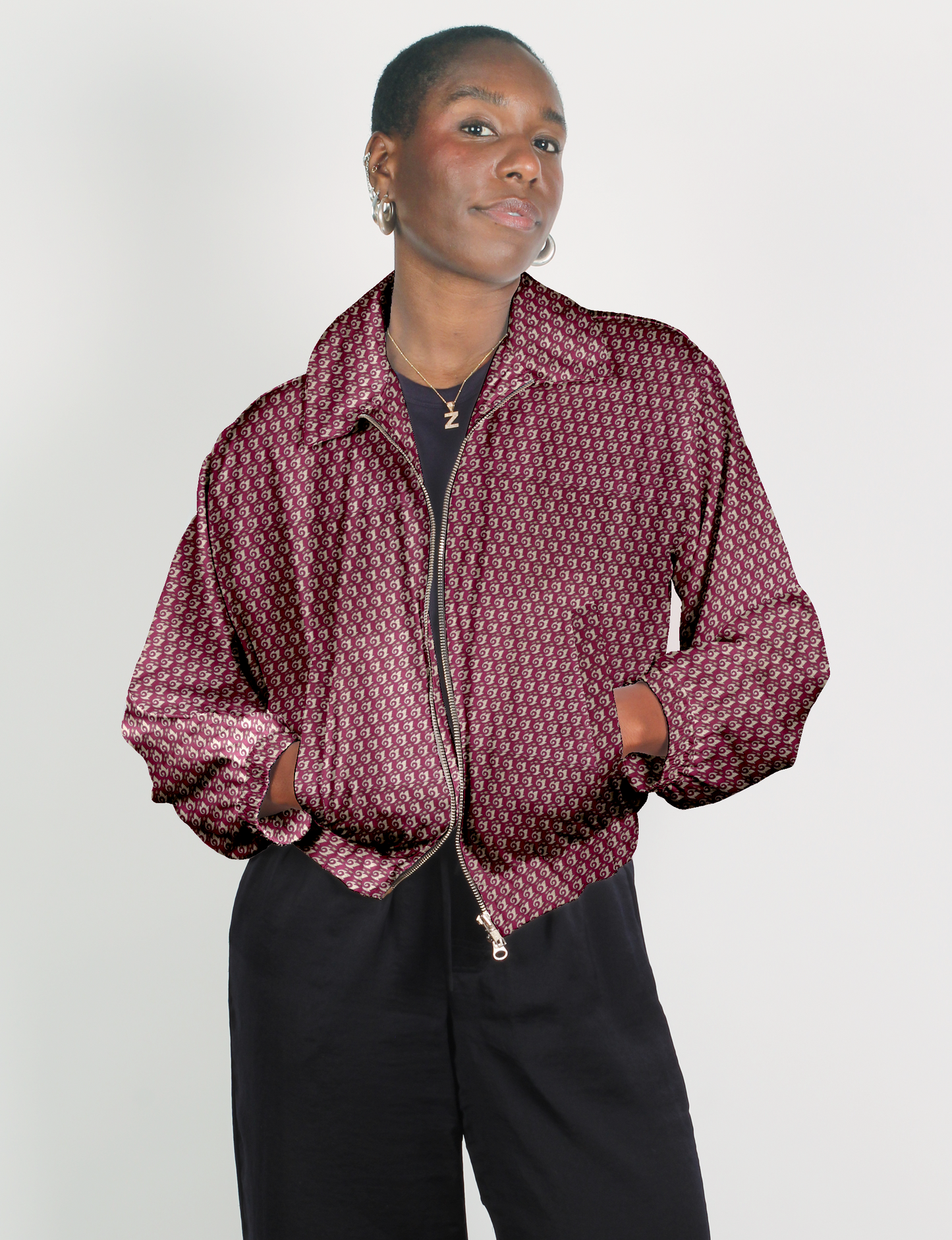 Upcycled Bomber Jacket made from recycled sari materials, featuring a cute cropped shape, elasticated hem and cuffs, and contrast sari print lining. Sustainable apparel promoting eco-friendly fashion and ethical clothing.