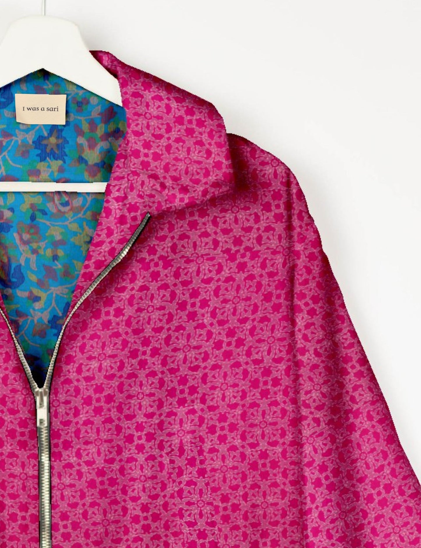 Upcycled Bomber Jacket made from recycled sari materials, featuring a cute cropped shape, elasticated hem and cuffs, and contrast sari print lining. Sustainable apparel promoting eco-friendly fashion and ethical clothing.