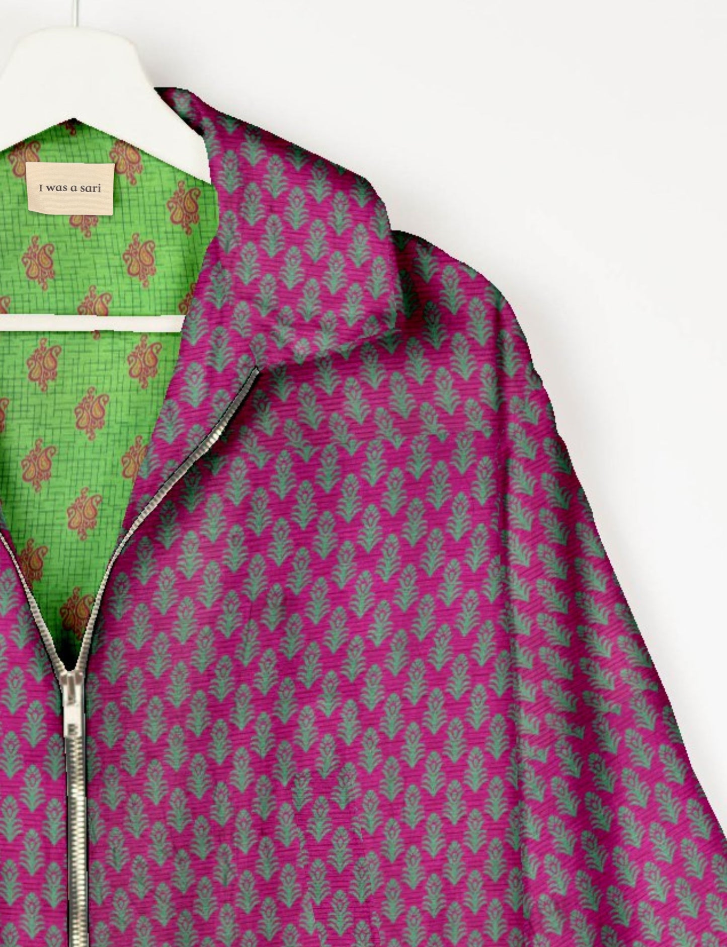 Upcycled Bomber Jacket made from recycled sari materials, featuring a cute cropped shape, elasticated hem and cuffs, and contrast sari print lining. Sustainable apparel promoting eco-friendly fashion and ethical clothing.