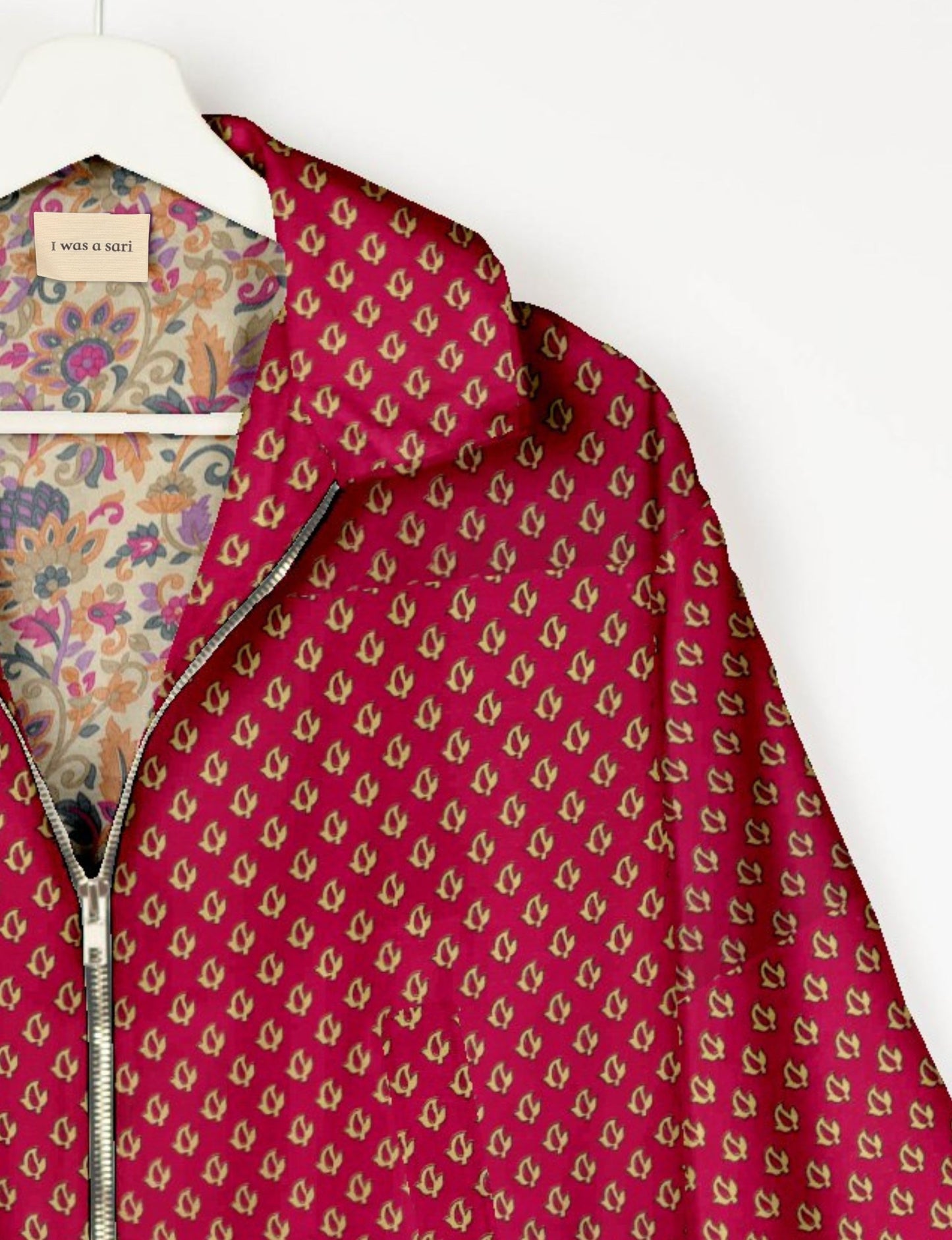 Upcycled Bomber Jacket made from recycled sari materials, featuring a cute cropped shape, elasticated hem and cuffs, and contrast sari print lining. Sustainable apparel promoting eco-friendly fashion and ethical clothing.