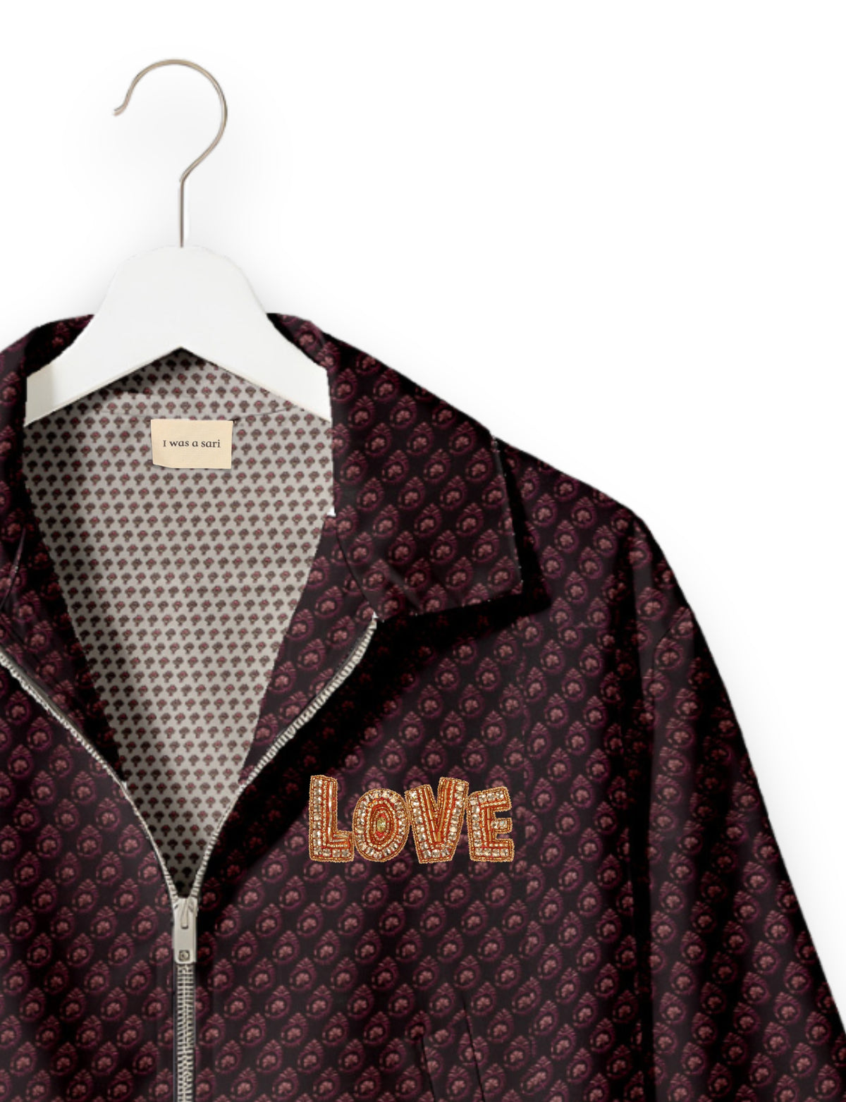 Love Bomber Jacket made from recycled fabric, featuring hand-stitched Aari embroidery. A unique piece of zero-waste clothing, part of the circular fashion movement. Designed with upcycled materials for a stylish yet environmentally friendly clothing choice.