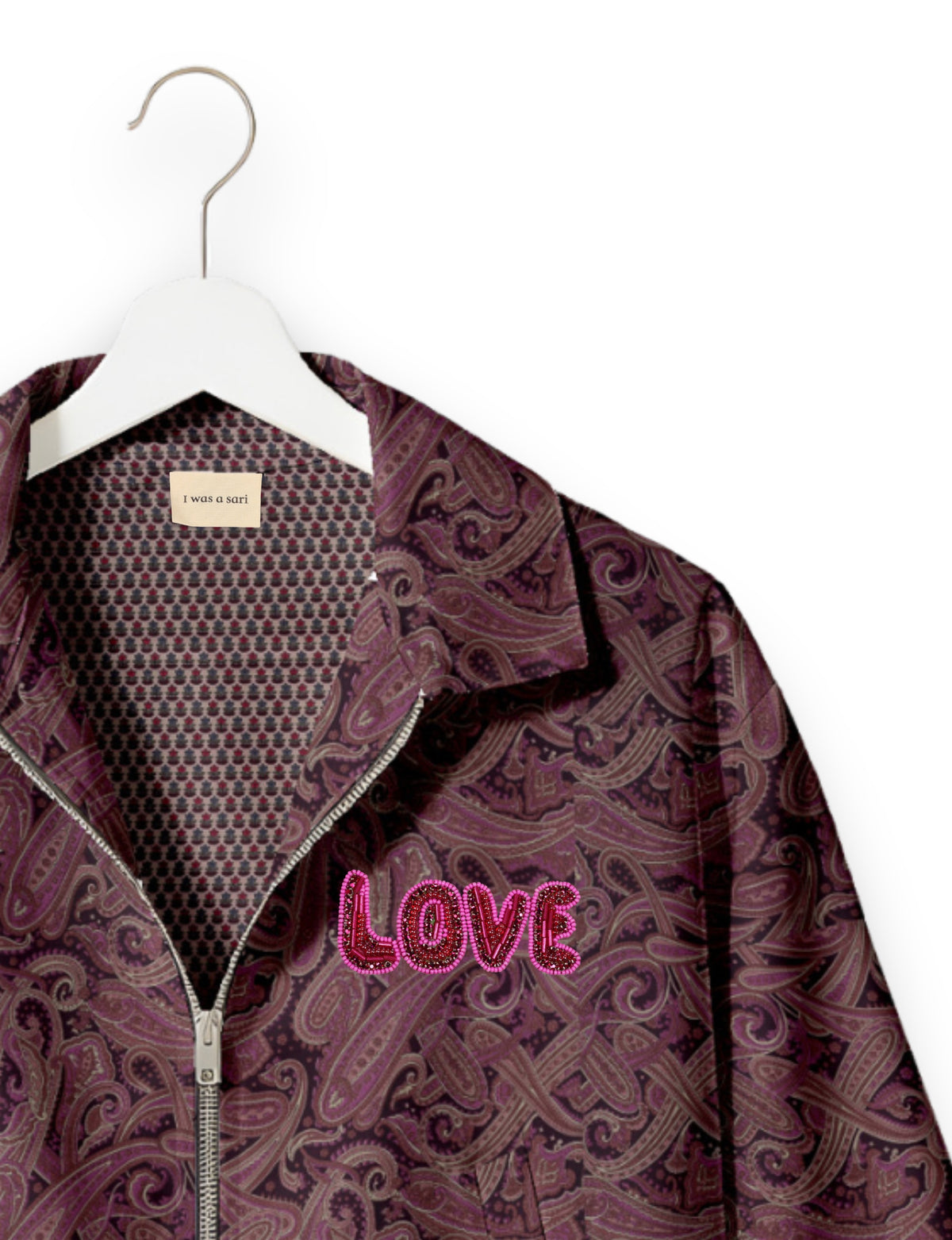 Love Bomber Jacket made from recycled fabric, featuring hand-stitched Aari embroidery. A unique piece of zero-waste clothing, part of the circular fashion movement. Designed with upcycled materials for a stylish yet environmentally friendly clothing choice.