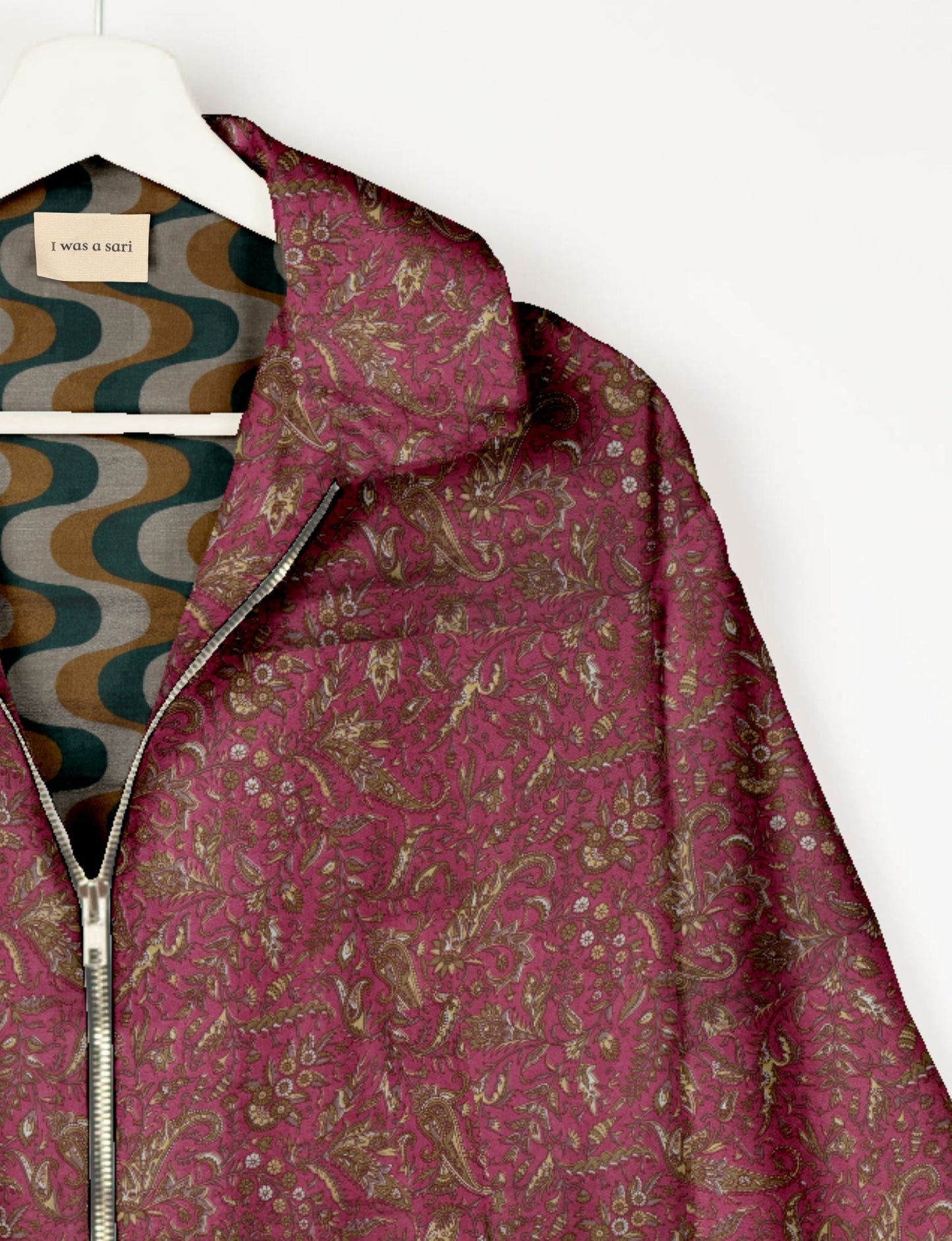 Upcycled Bomber Jacket made from recycled sari materials, featuring a cute cropped shape, elasticated hem and cuffs, and contrast sari print lining. Sustainable apparel promoting eco-friendly fashion and ethical clothing.