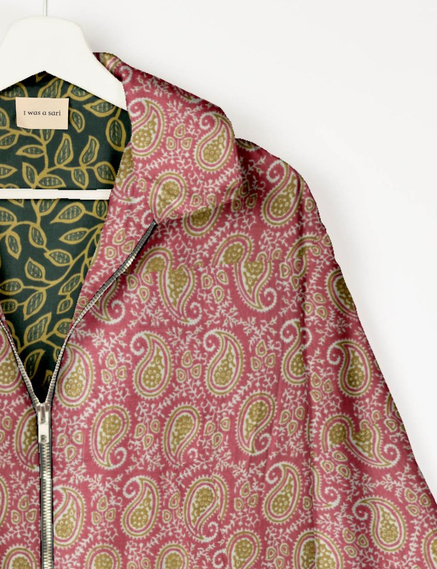 Upcycled Bomber Jacket made from recycled sari materials, featuring a cute cropped shape, elasticated hem and cuffs, and contrast sari print lining. Sustainable apparel promoting eco-friendly fashion and ethical clothing.