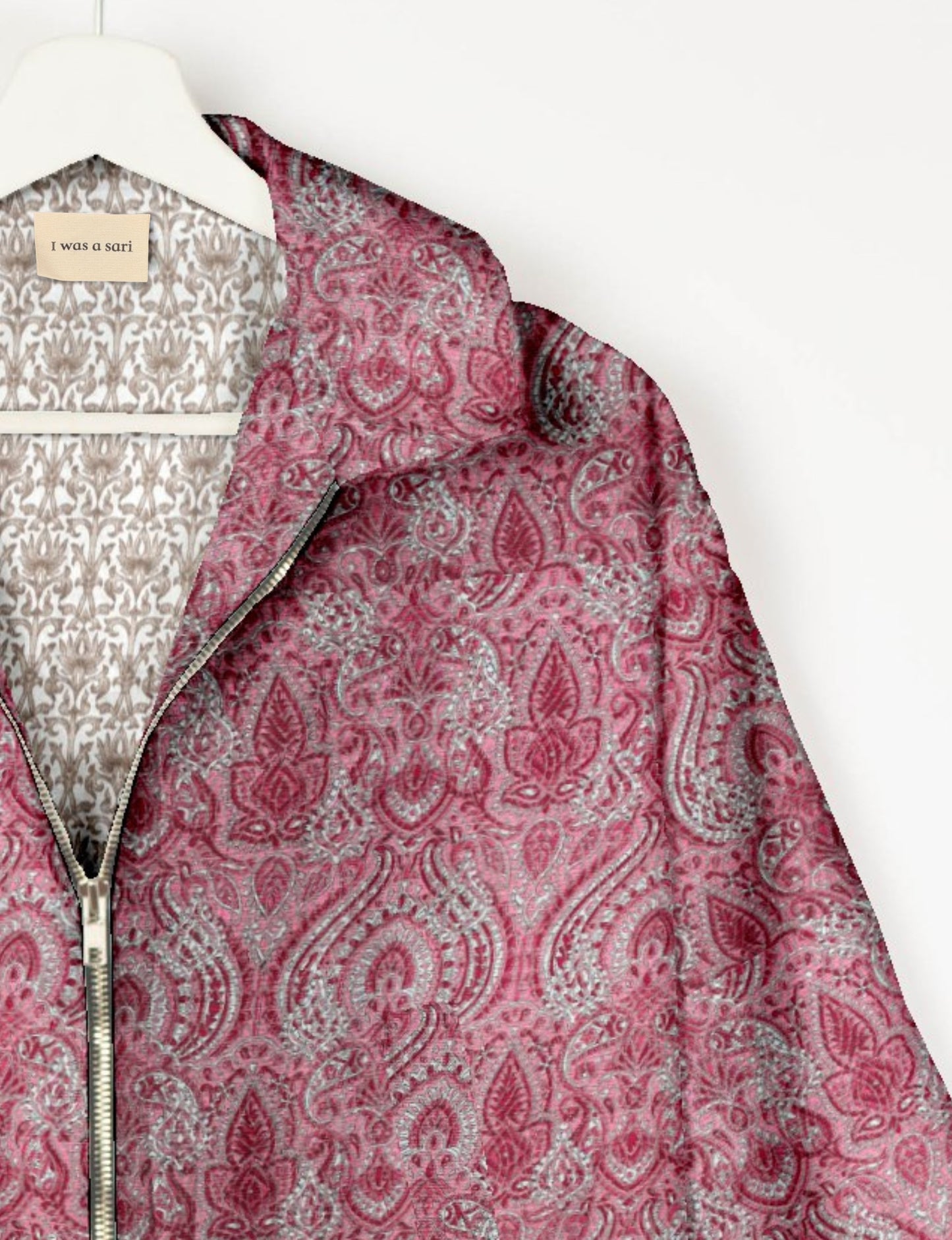 Upcycled Bomber Jacket made from recycled sari materials, featuring a cute cropped shape, elasticated hem and cuffs, and contrast sari print lining. Sustainable apparel promoting eco-friendly fashion and ethical clothing.