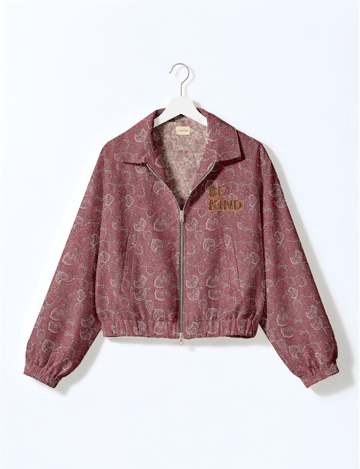 BE KIND Bomber jacket made from upcycled sari fabric with handcrafted Aari embroidery by female artisans.