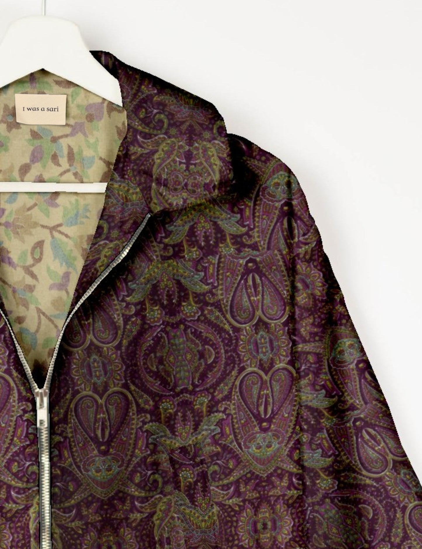 Upcycled Bomber Jacket made from recycled sari materials, featuring a cute cropped shape, elasticated hem and cuffs, and contrast sari print lining. Sustainable apparel promoting eco-friendly fashion and ethical clothing.