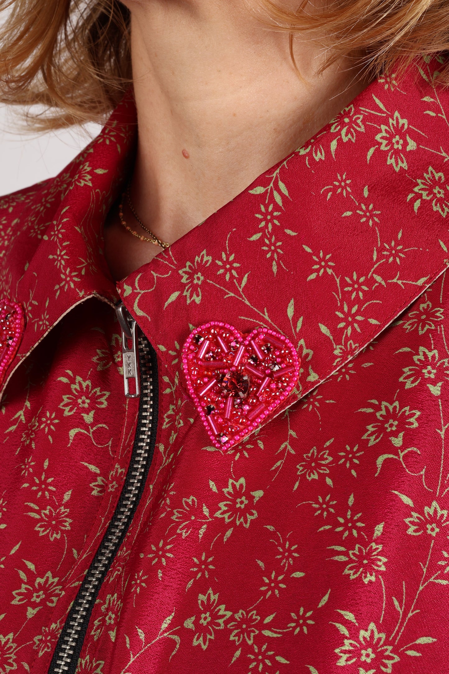 Make a bold statement with our Heart Drop Earrings, a symbol of conscious luxury and ethical fashion. Handcrafted using the intricate Aari embroidery technique, these earrings are made from upcycled sari fabric, embracing slow fashion and zero waste clothing. Elevate your look with sustainable apparel that supports fair trade fashion while reducing textile waste. Choose eco-friendly fashion that speaks of love, artistry, and responsibility.