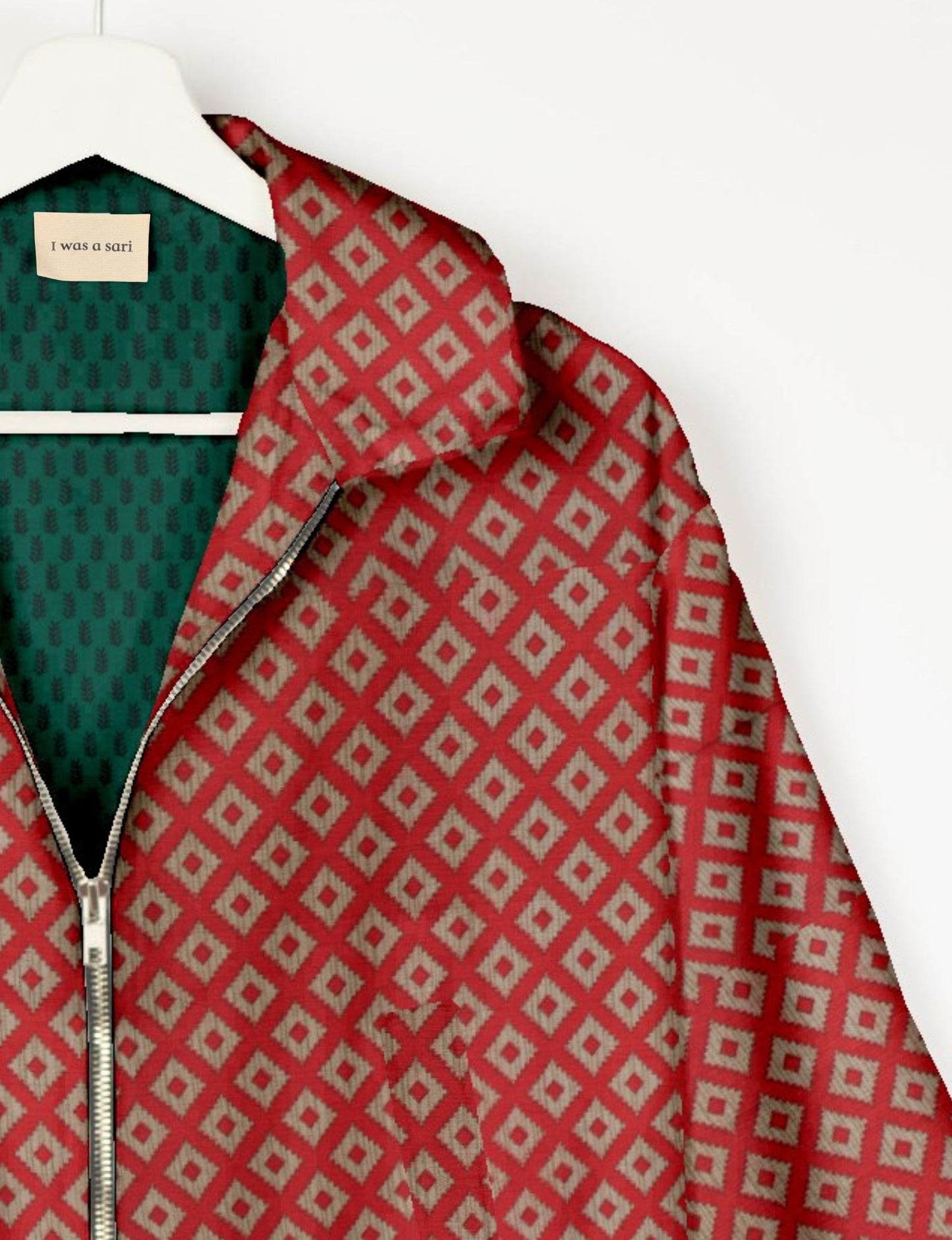 Upcycled Bomber Jacket made from recycled sari materials, featuring a cute cropped shape, elasticated hem and cuffs, and contrast sari print lining. Sustainable apparel promoting eco-friendly fashion and ethical clothing.