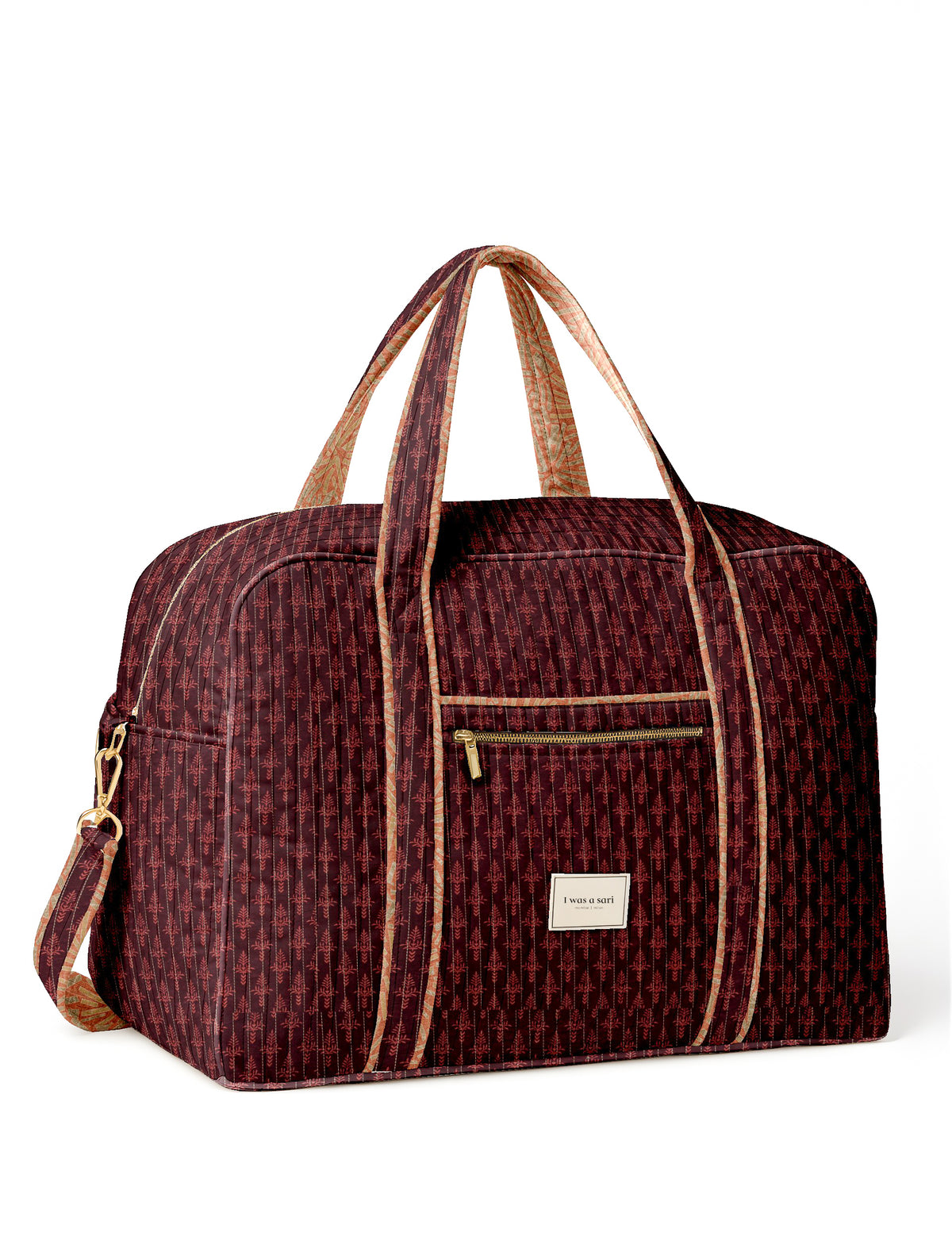 Twin travel duffle bag in maroon with assorted micro design pattern and front zip pocket, shown from front view