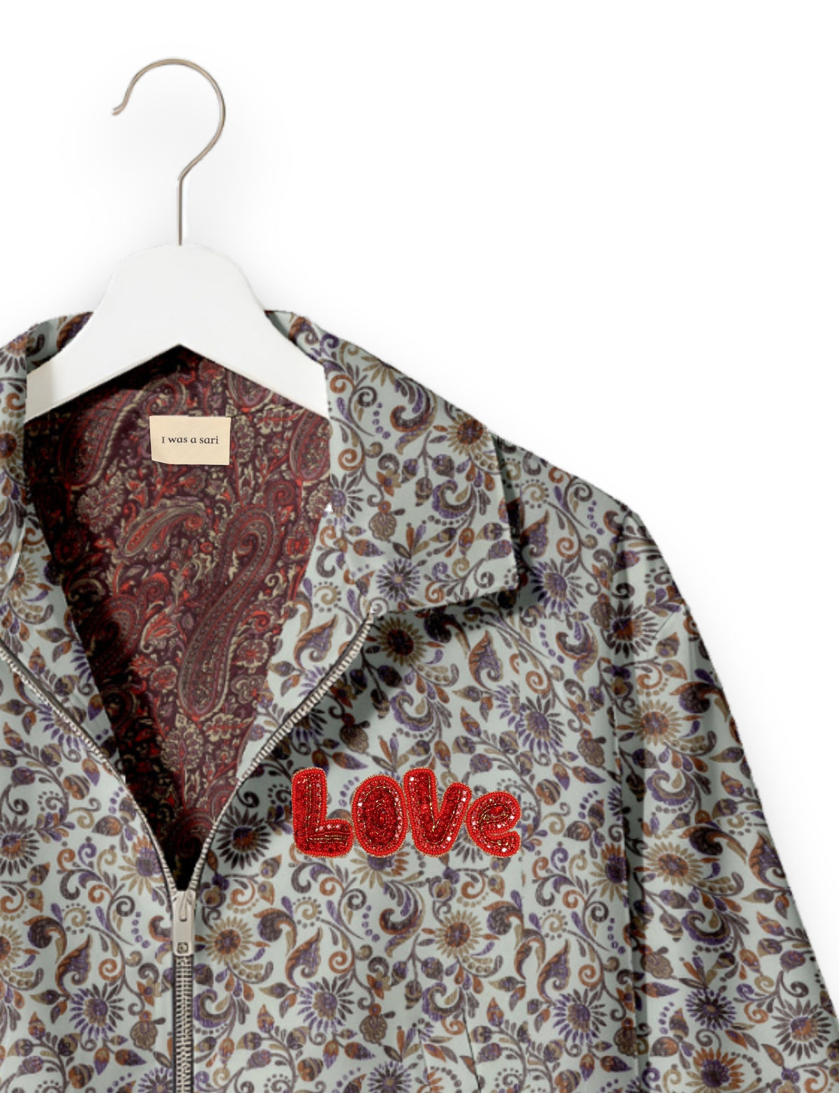 Love Bomber Jacket made from recycled fabric, featuring hand-stitched Aari embroidery. A unique piece of zero-waste clothing, part of the circular fashion movement. Designed with upcycled materials for a stylish yet environmentally friendly clothing choice.