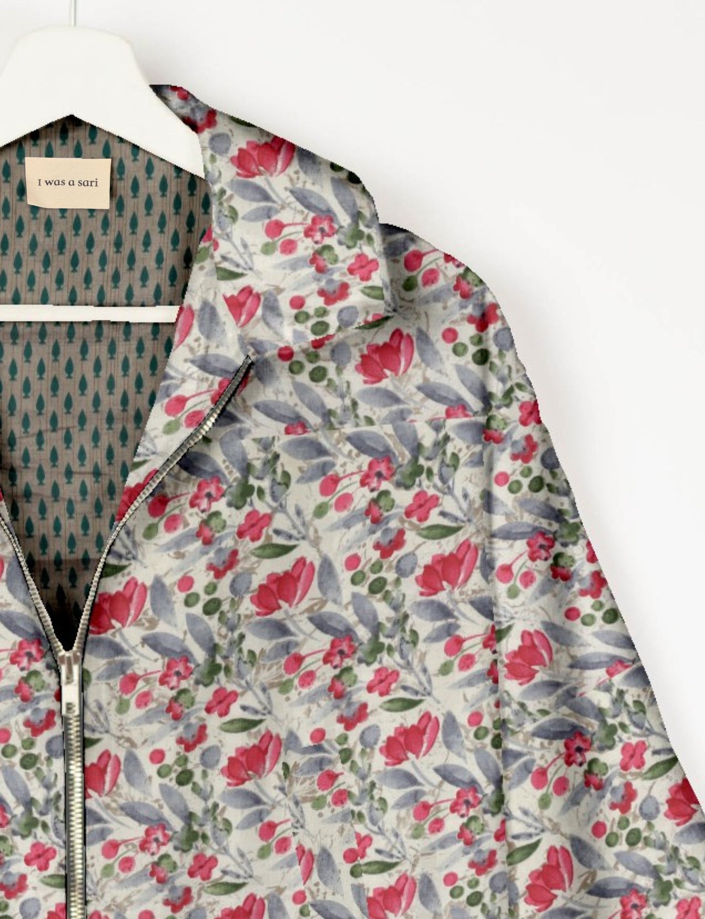 Upcycled Bomber Jacket made from recycled sari materials, featuring a cute cropped shape, elasticated hem and cuffs, and contrast sari print lining. Sustainable apparel promoting eco-friendly fashion and ethical clothing.