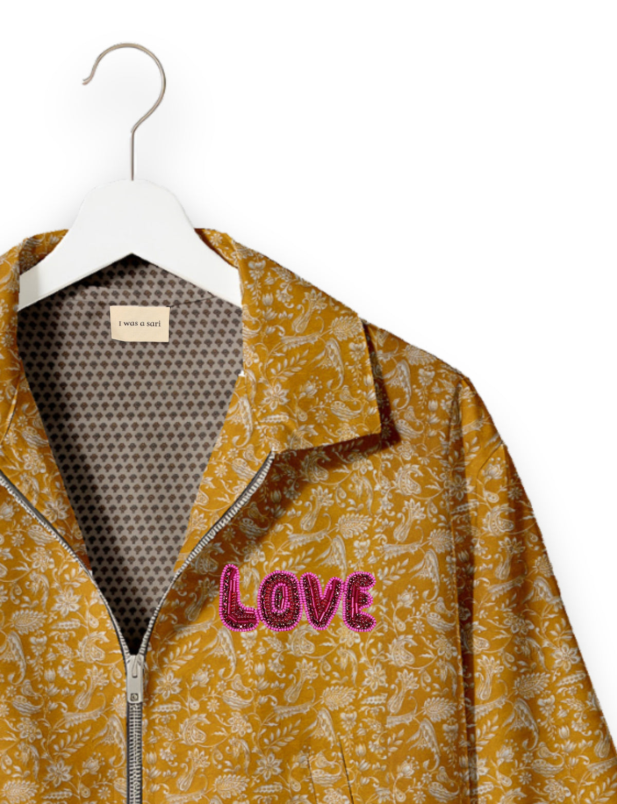 Love Bomber Jacket made from recycled fabric, featuring hand-stitched Aari embroidery. A unique piece of zero-waste clothing, part of the circular fashion movement. Designed with upcycled materials for a stylish yet environmentally friendly clothing choice.