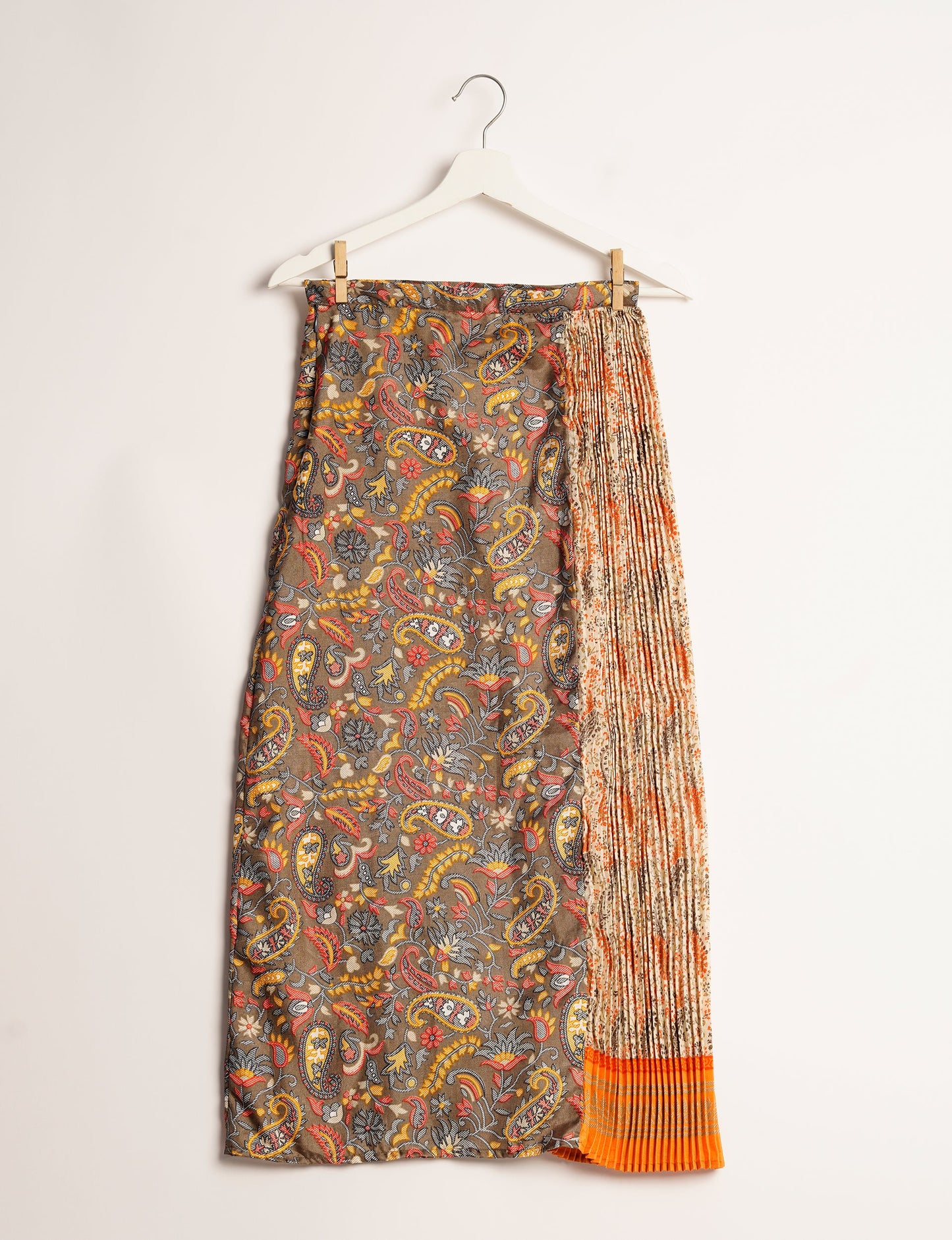 Elevate your wardrobe with the Semi Pleated A-Line Skirt, a sustainable fashion statement. Unique prints, a mix of fabrics, and intricate knife pleats create an individualized, upscale day-to-night look. Crafted with ethical and green fashion values, this skirt represents the essence of eco-friendly style.