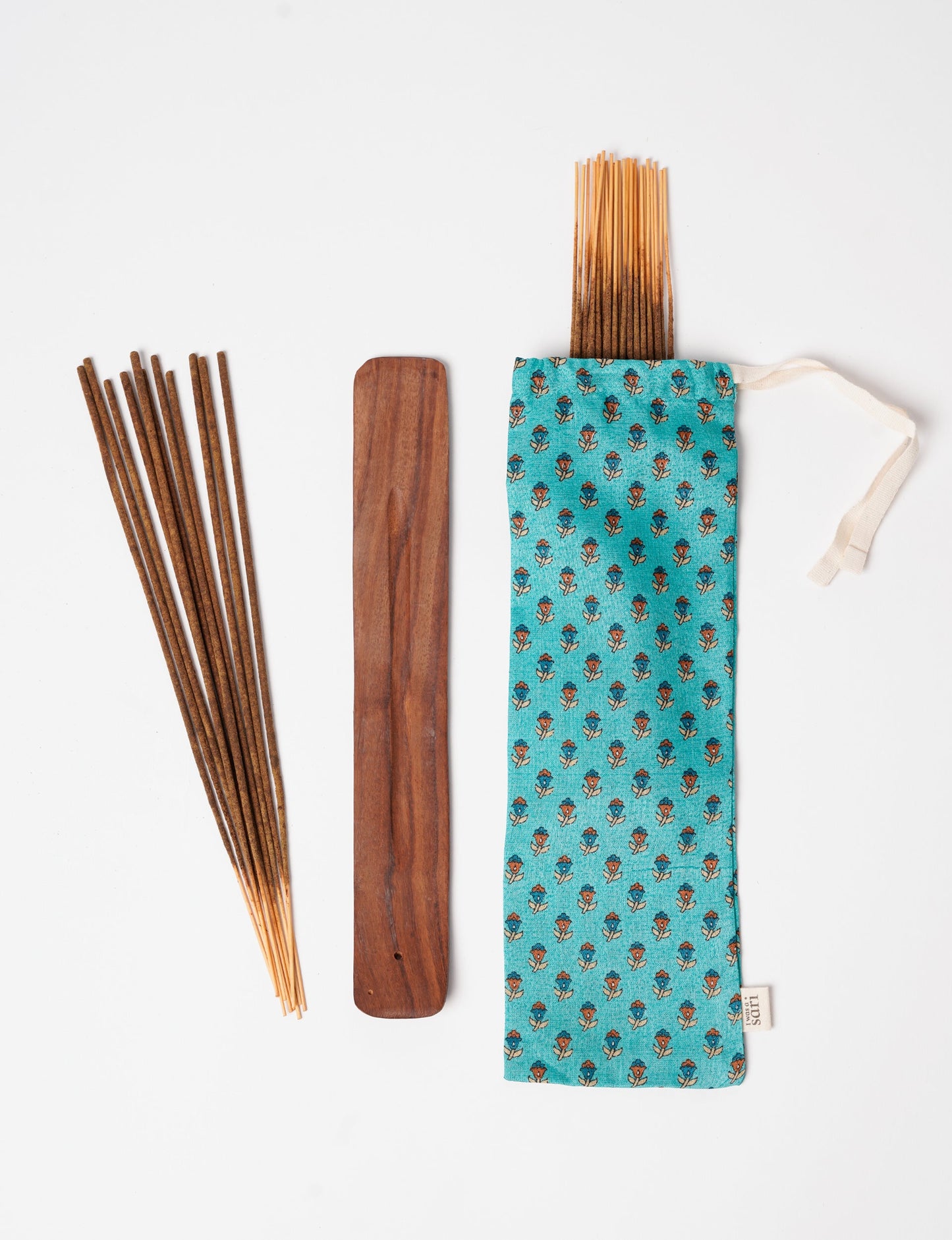 Discover serenity with our Incense Stick Set, presented in a beautifully crafted sari pouch. Made from fragrant flowers, these incense sticks embody eco-friendly products and sustainable living, perfect for conscious consumers seeking ethical clothing and green fashion alternatives.