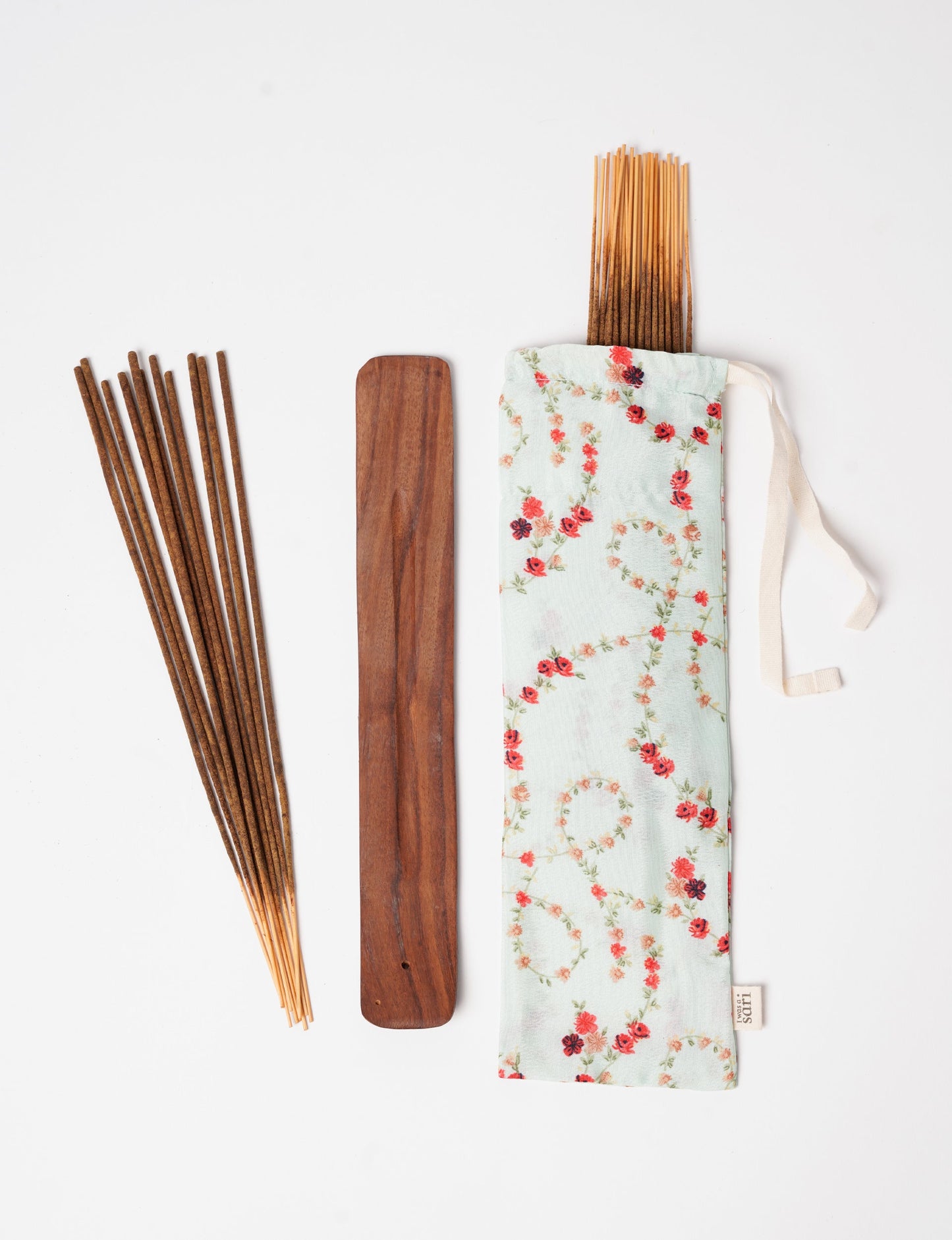 Discover serenity with our Incense Stick Set, presented in a beautifully crafted sari pouch. Made from fragrant flowers, these incense sticks embody eco-friendly products and sustainable living, perfect for conscious consumers seeking ethical clothing and green fashion alternatives.