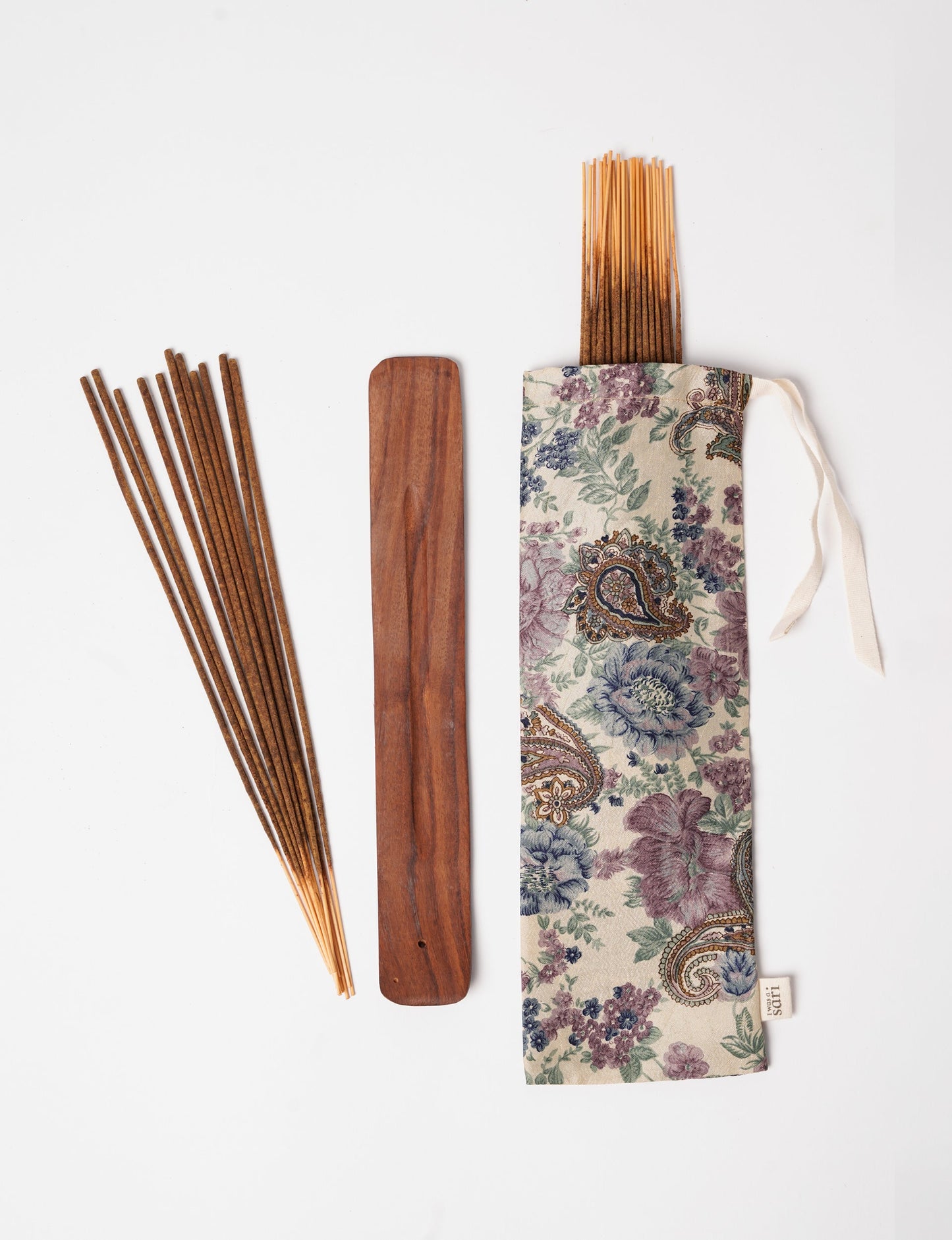 Discover serenity with our Incense Stick Set, presented in a beautifully crafted sari pouch. Made from fragrant flowers, these incense sticks embody eco-friendly products and sustainable living, perfect for conscious consumers seeking ethical clothing and green fashion alternatives.