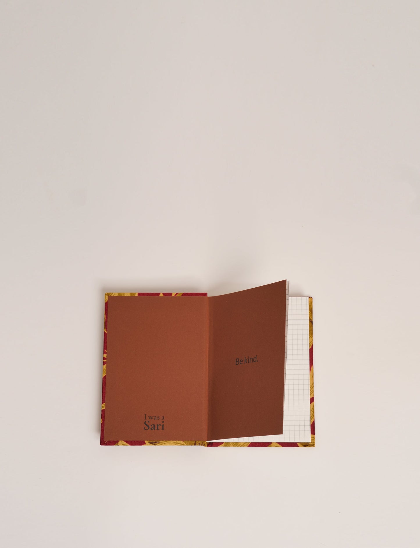 Indulge your creative spirit with our A6 hardcover notebook – a blend of sustainability and style. Made with 100% recycled paper and adorned with pre-loved sari fabric, this eco-conscious notebook encourages mindful note-taking and resonates with the principles of eco-friendly fashion.