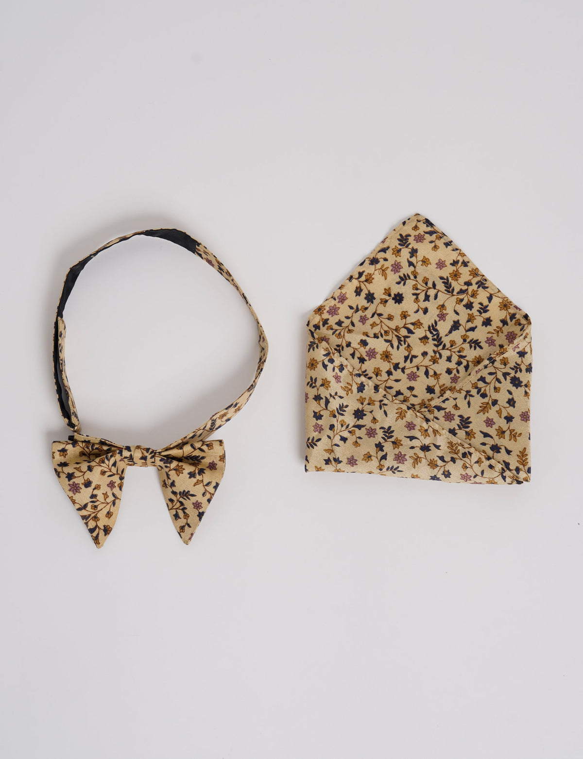 Dapper BOW TIE & POCKET SQUARE SET, ethically handcrafted with lively prints and eye-catching colors. Made by Mumbai-based craftswomen, this ensemble adds excitement to classic formal-wear. Sustainable fashion supporting fair trade, slow fashion, and empowering women artisans. A powerful story of transformation.