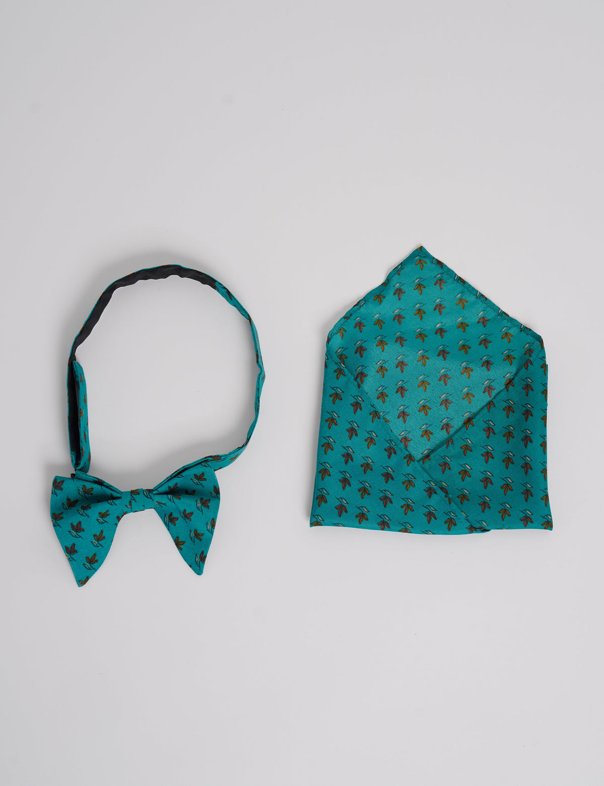 Dapper BOW TIE & POCKET SQUARE SET, ethically handcrafted with lively prints and eye-catching colors. Made by Mumbai-based craftswomen, this ensemble adds excitement to classic formal-wear. Sustainable fashion supporting fair trade, slow fashion, and empowering women artisans. A powerful story of transformation.
