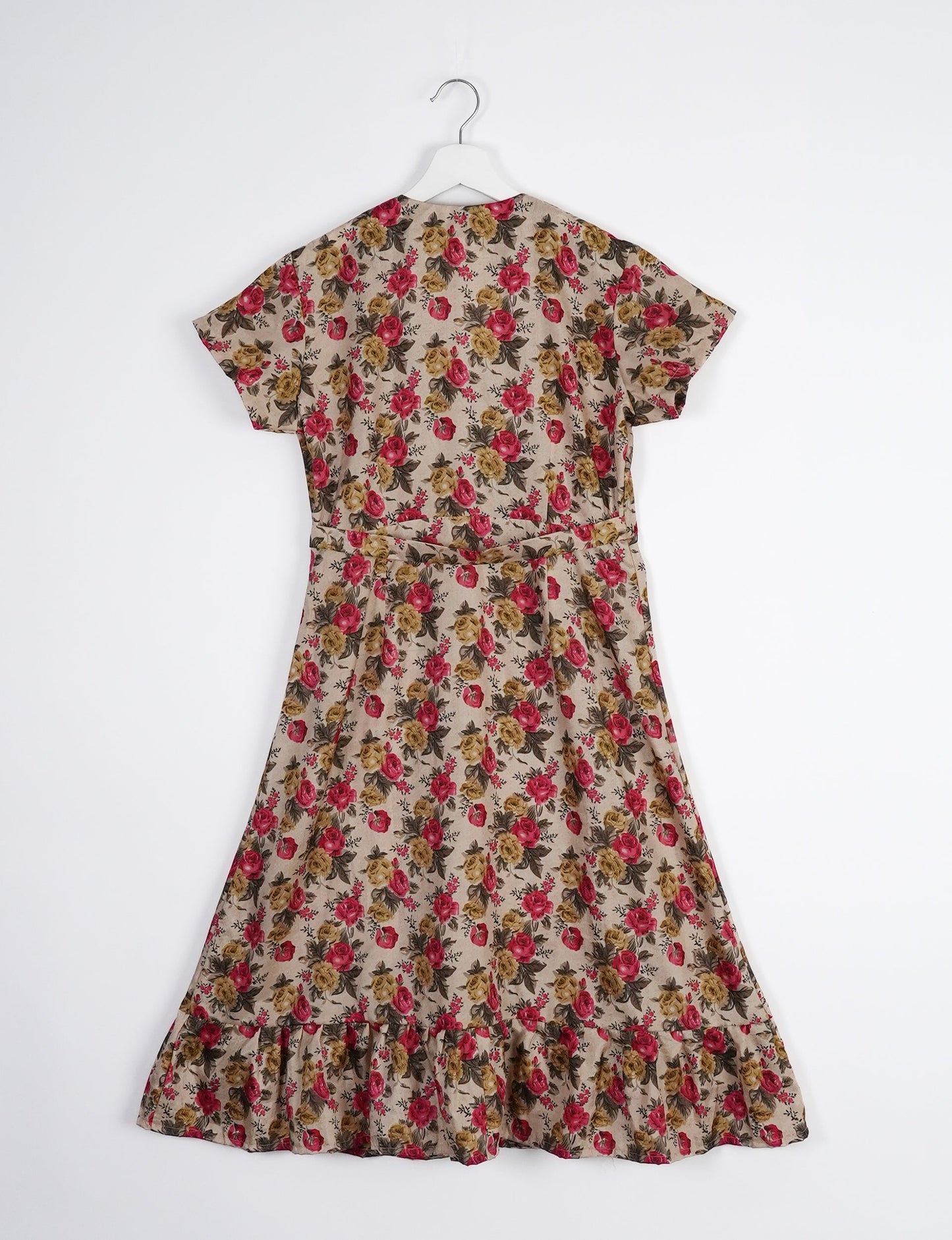 Embrace timeless elegance with our MIDI WRAP DRESS – a midi-length beauty featuring a v-neck, flattery from all angles, and a charming sari belt. Crafted from sustainable materials, this dress embodies ethical clothing and green fashion. Sophisticated with a frill tier at the hem and short cap sleeves, this dress is perfect for any occasion. Tie up the beautifully crafted sari belt on the side for a versatile, stylish, and eco-friendly look.