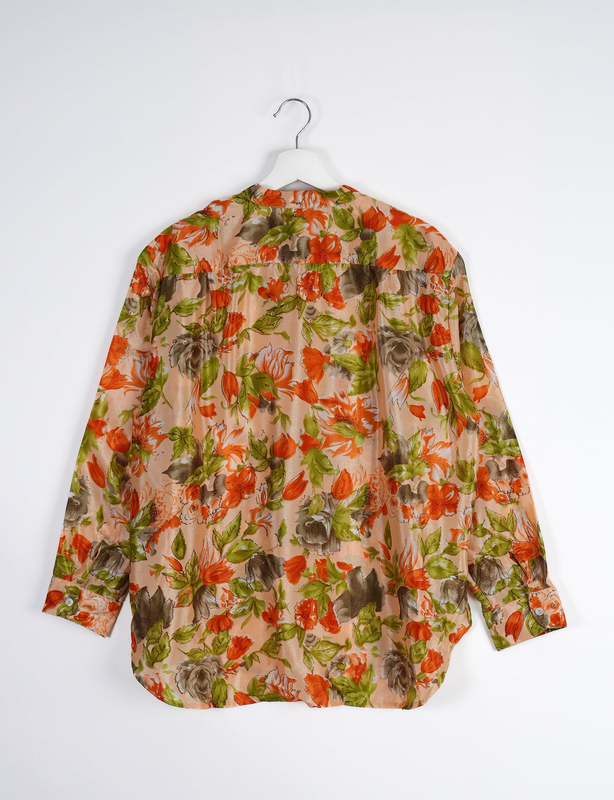 Sophisticated LONGLINE SHIRT with mandarin collar, bias yoke, and delicate bead embroidery edging. Crafted for sustainable fashion enthusiasts, this eco-friendly shirt offers versatile styling and timeless elegance for your conscious wardrobe.