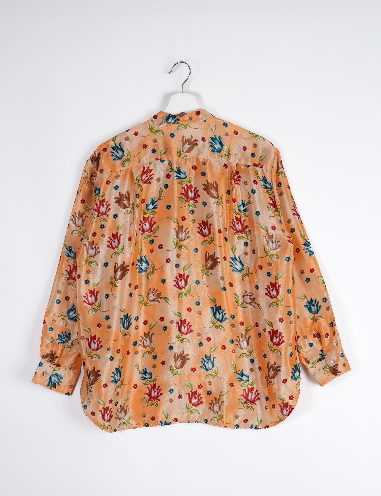 Sophisticated LONGLINE SHIRT with mandarin collar, bias yoke, and delicate bead embroidery edging. Crafted for sustainable fashion enthusiasts, this eco-friendly shirt offers versatile styling and timeless elegance for your conscious wardrobe.