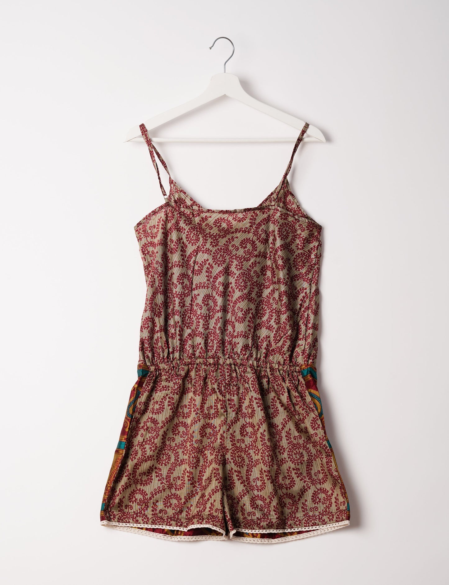 Vibrant playsuit with lace accents, crafted from upcycled saris. Embrace ethical fashion with this unique piece designed for conscious consumers.