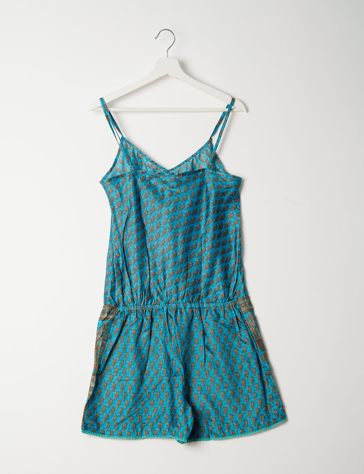 Vibrant playsuit with lace accents, crafted from upcycled saris. Embrace ethical fashion with this unique piece designed for conscious consumers.