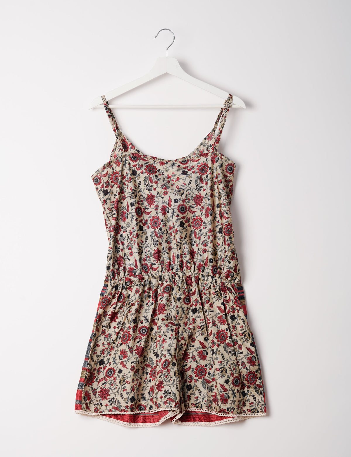 Vibrant playsuit with lace accents, crafted from upcycled saris. Embrace ethical fashion with this unique piece designed for conscious consumers.