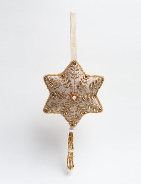 Gold colored snowflake ornament