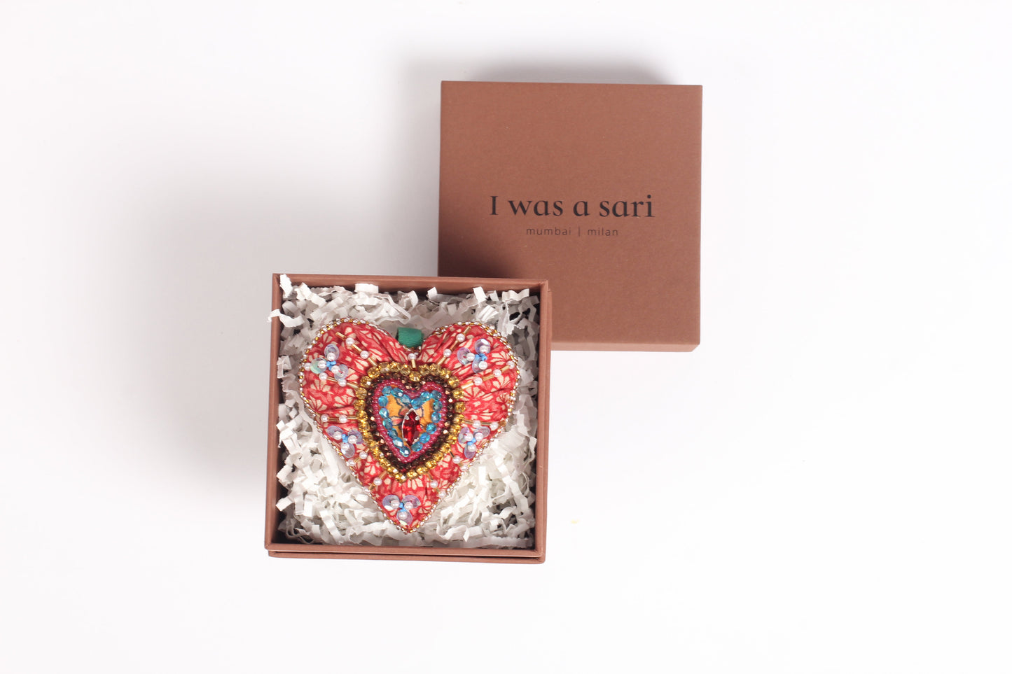 Heart-shaped Artisans Christmas Ornament crafted from upcycled saris with intricate design, symbolizing love and kindness. An eco-friendly, sustainable fashion piece that supports ethical, zero-waste, and recycled clothing ideals.