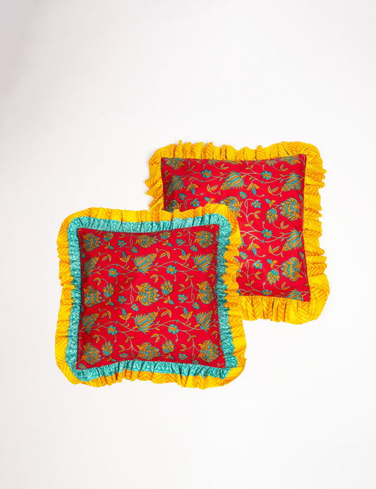 Double frill cushion covers made from recycled materials, showcasing slow fashion and repurposed clothing aesthetics. These upcycled garments feature a vibrant design with fair trade fashion principles, embodying conscious clothing and sustainable products. Perfect for homes embracing eco-friendly decor and recycled sustainable fashion ideals.