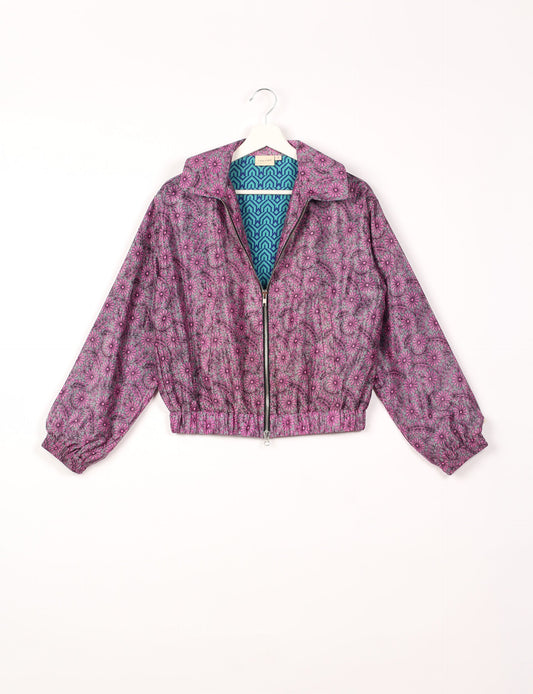 Stylish BOMBER JACKET, an upcycled clothing masterpiece with a cute cropped shape, elasticated details, and detachable metallic zipper. Contrast sari print lining adds a unique touch. Explore sustainable and eco-friendly fashion.