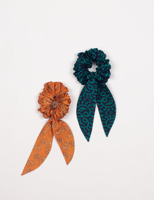 Colorful Tail Scrunchy made from sustainable, upcycled women's clothing. An eco-friendly fashion accessory promoting green fashion, recycled clothing, and ethical fashion choices.