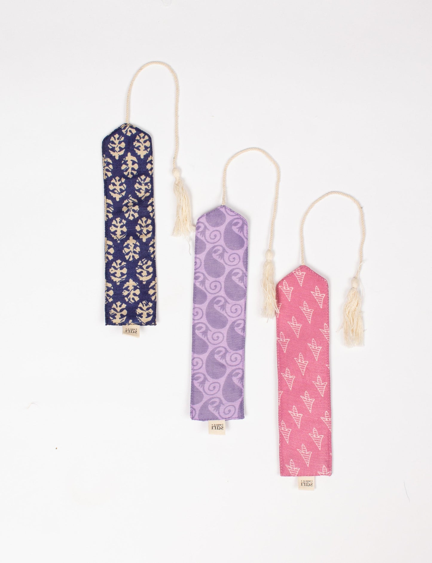 A chic Cloth Bookmark from BOOKMARK, made from upcycled garments, showcasing ethical fashion and sustainable practices. Perfect for elevating your reading experience while embracing zero waste clothing and slow fashion. Explore eco-friendly products crafted from recycled materials for an elegant touch to your favorite books.