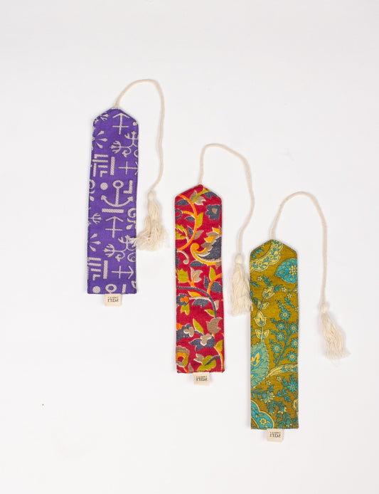 A chic Cloth Bookmark from BOOKMARK, made from upcycled garments, showcasing ethical fashion and sustainable practices. Perfect for elevating your reading experience while embracing zero waste clothing and slow fashion. Explore eco-friendly products crafted from recycled materials for an elegant touch to your favorite books.