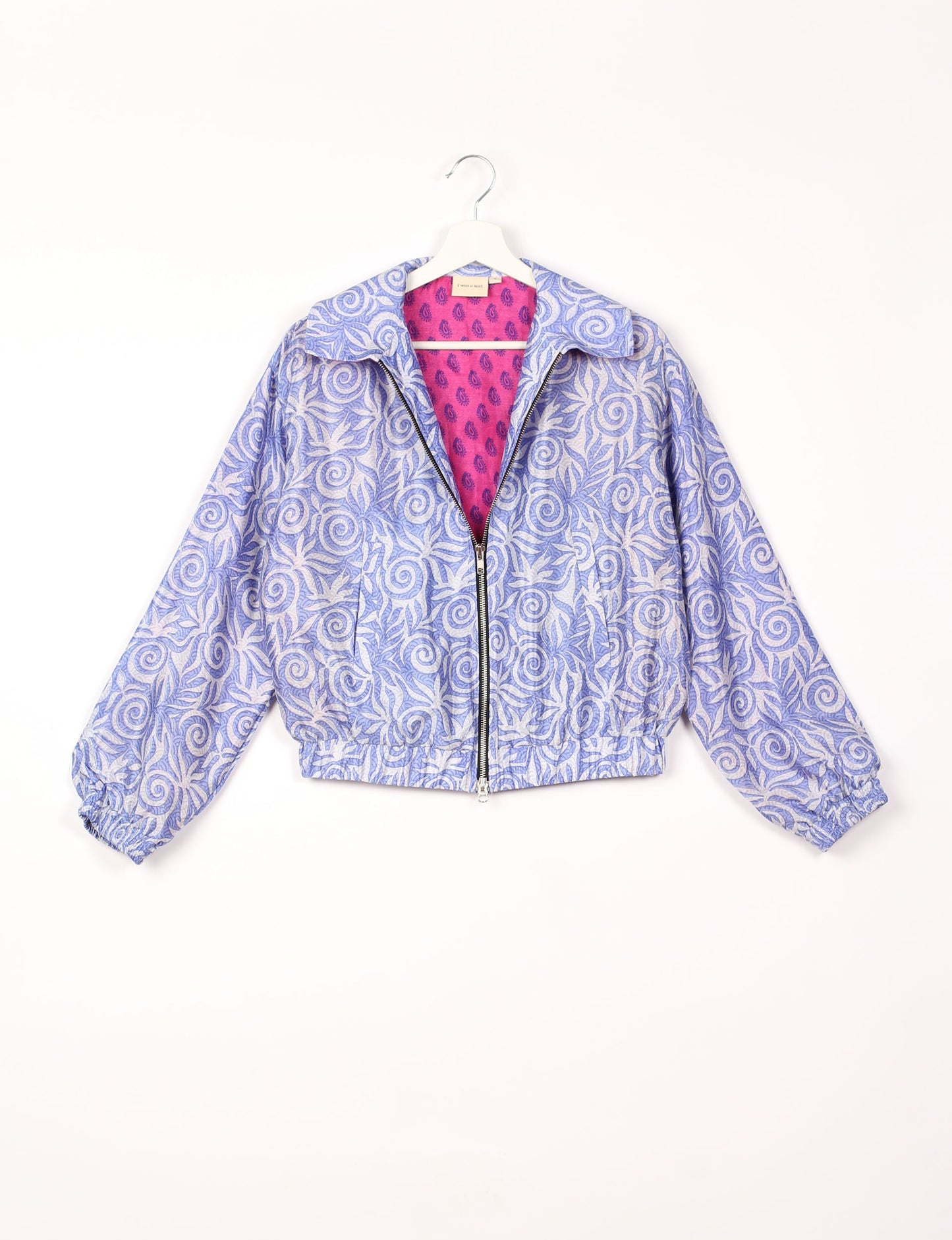 Stylish BOMBER JACKET, an upcycled clothing masterpiece with a cute cropped shape, elasticated details, and detachable metallic zipper. Contrast sari print lining adds a unique touch. Explore sustainable and eco-friendly fashion.