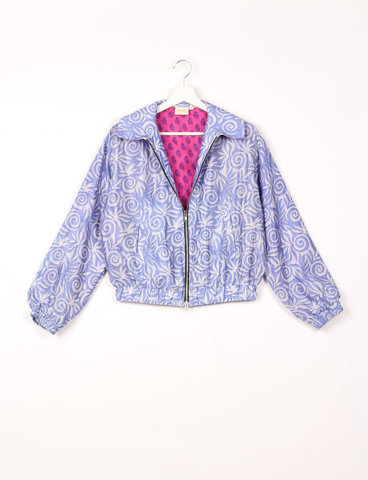 Stylish BOMBER JACKET, an upcycled clothing masterpiece with a cute cropped shape, elasticated details, and detachable metallic zipper. Contrast sari print lining adds a unique touch. Explore sustainable and eco-friendly fashion.