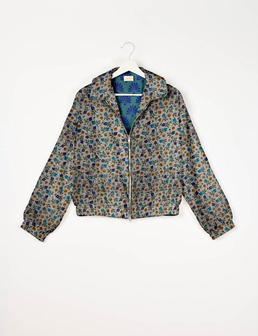 Upcycled Bomber Jacket made from recycled sari materials, featuring a cute cropped shape, elasticated hem and cuffs, and contrast sari print lining. Sustainable apparel promoting eco-friendly fashion and ethical clothing.