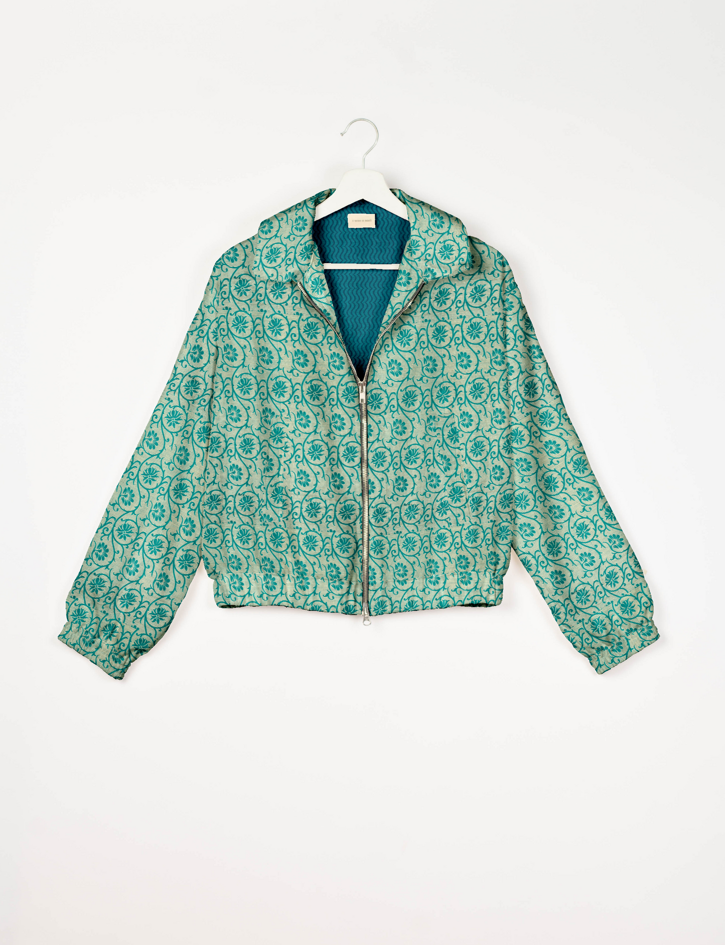 Upcycled Bomber Jacket made from recycled sari materials, featuring a cute cropped shape, elasticated hem and cuffs, and contrast sari print lining. Sustainable apparel promoting eco-friendly fashion and ethical clothing.