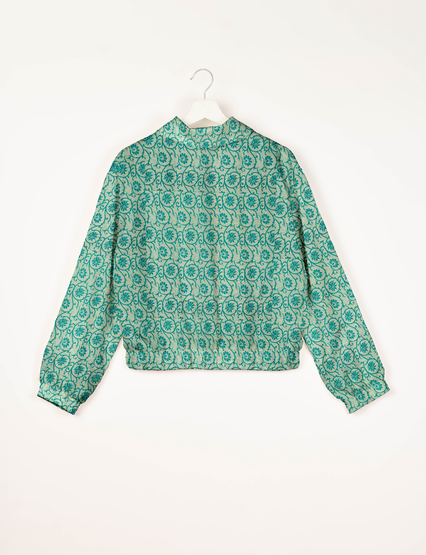 Upcycled Bomber Jacket made from recycled sari materials, featuring a cute cropped shape, elasticated hem and cuffs, and contrast sari print lining. Sustainable apparel promoting eco-friendly fashion and ethical clothing.