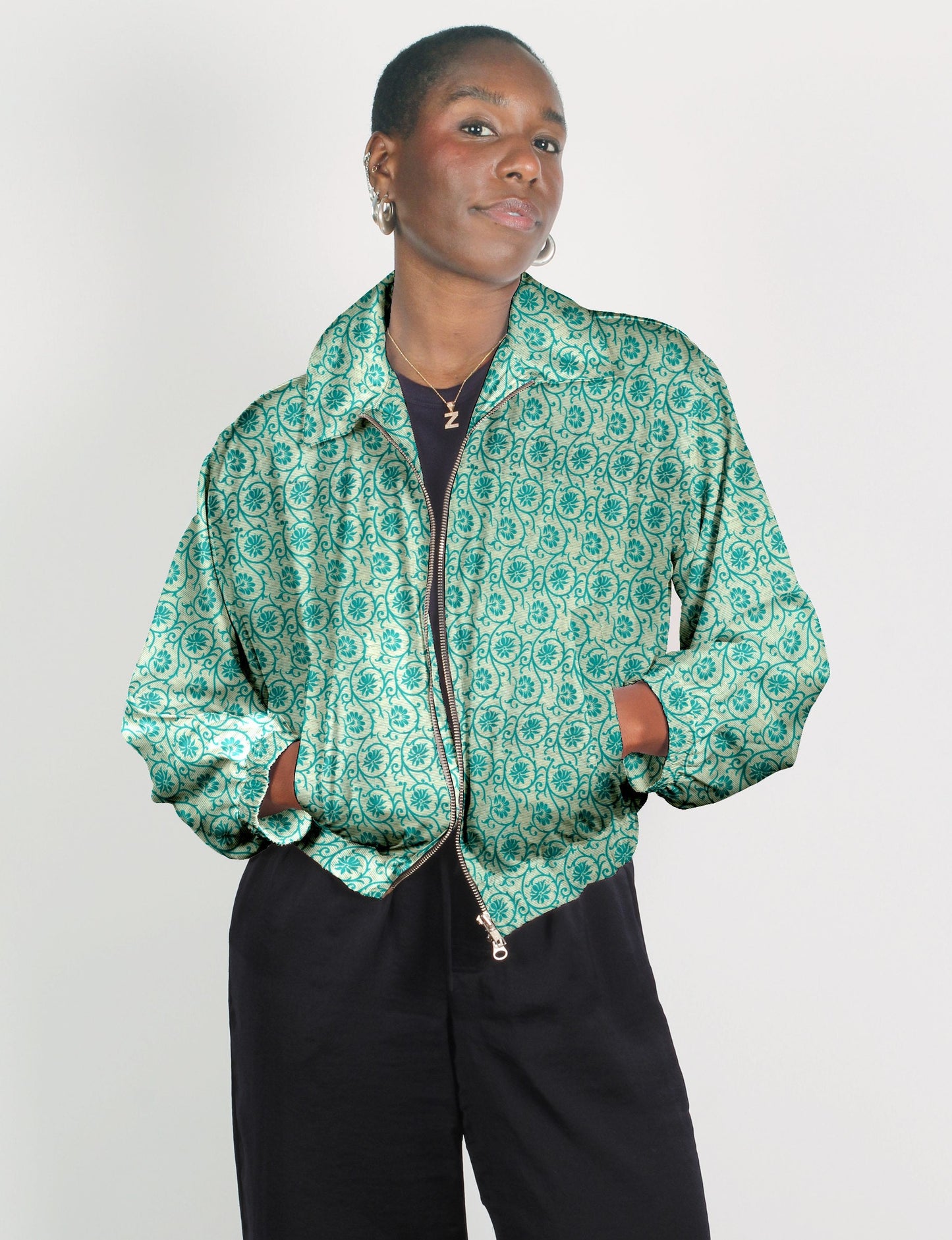 Upcycled Bomber Jacket made from recycled sari materials, featuring a cute cropped shape, elasticated hem and cuffs, and contrast sari print lining. Sustainable apparel promoting eco-friendly fashion and ethical clothing.