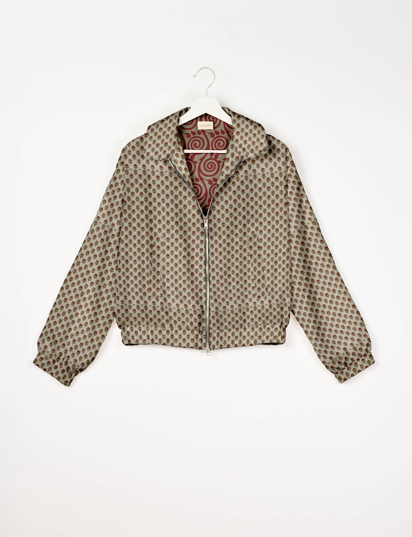 Upcycled Bomber Jacket made from recycled sari materials, featuring a cute cropped shape, elasticated hem and cuffs, and contrast sari print lining. Sustainable apparel promoting eco-friendly fashion and ethical clothing.