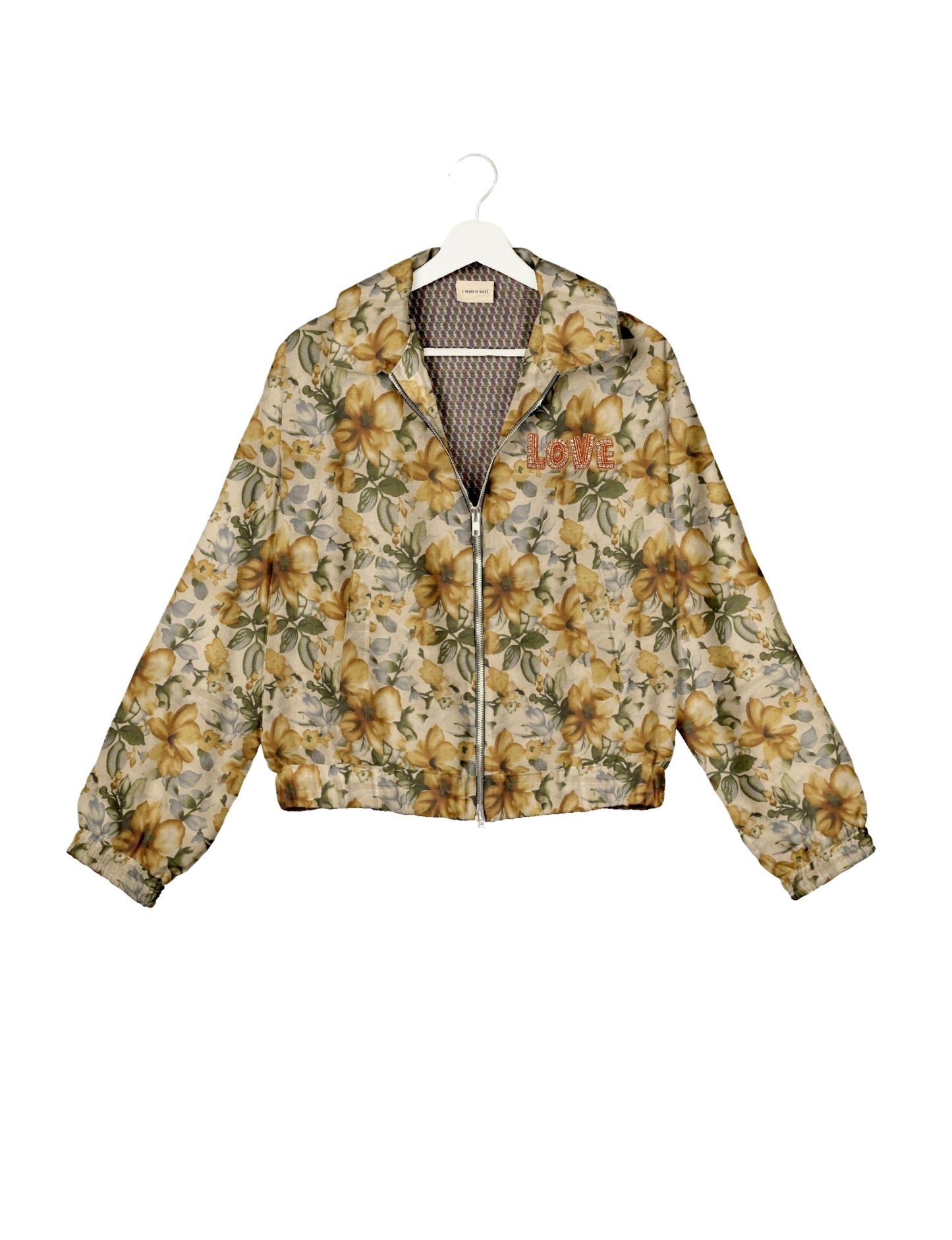 Love Bomber Jacket made from recycled fabric, featuring hand-stitched Aari embroidery. A unique piece of zero-waste clothing, part of the circular fashion movement. Designed with upcycled materials for a stylish yet environmentally friendly clothing choice.