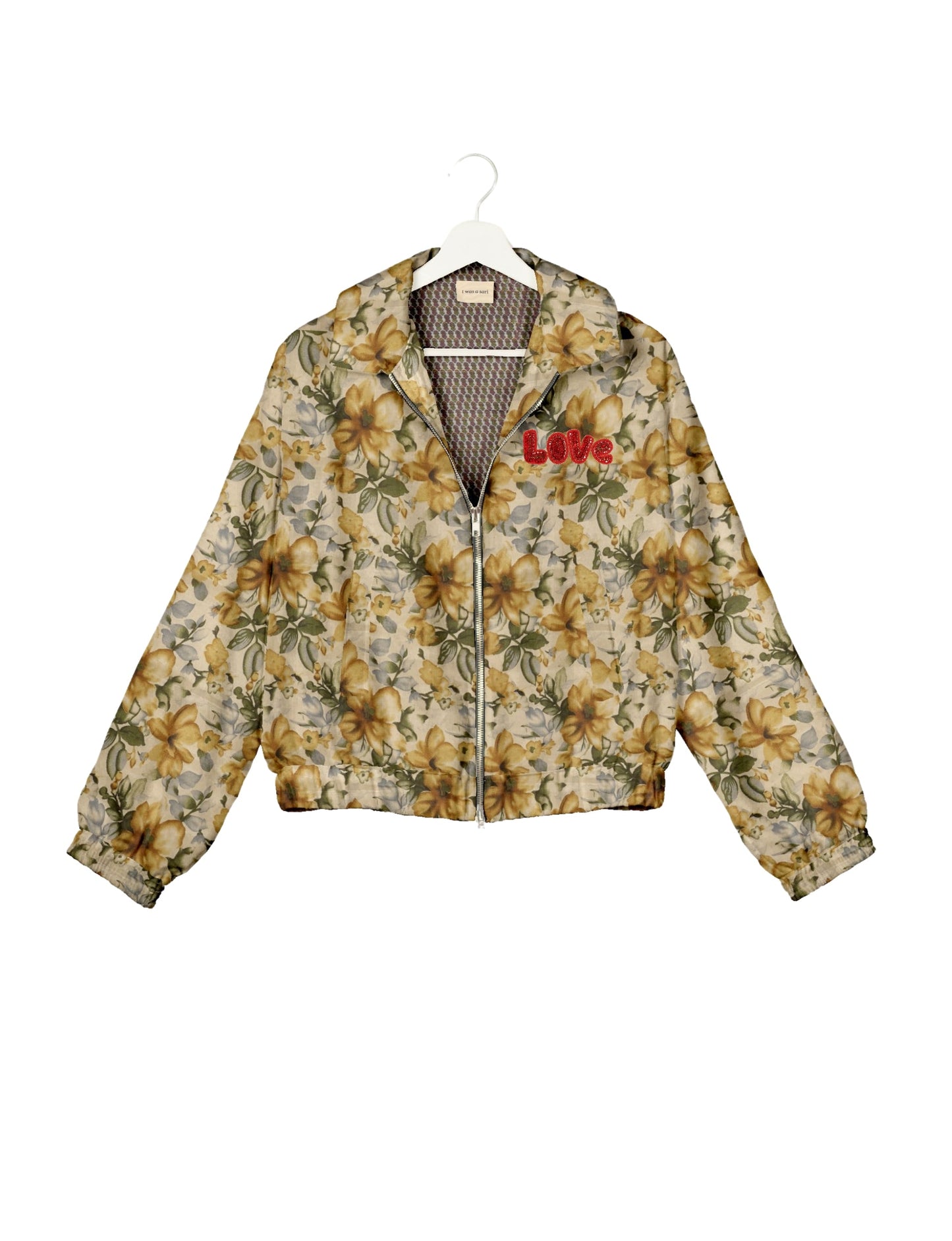 Love Bomber Jacket made from recycled fabric, featuring hand-stitched Aari embroidery. A unique piece of zero-waste clothing, part of the circular fashion movement. Designed with upcycled materials for a stylish yet environmentally friendly clothing choice.