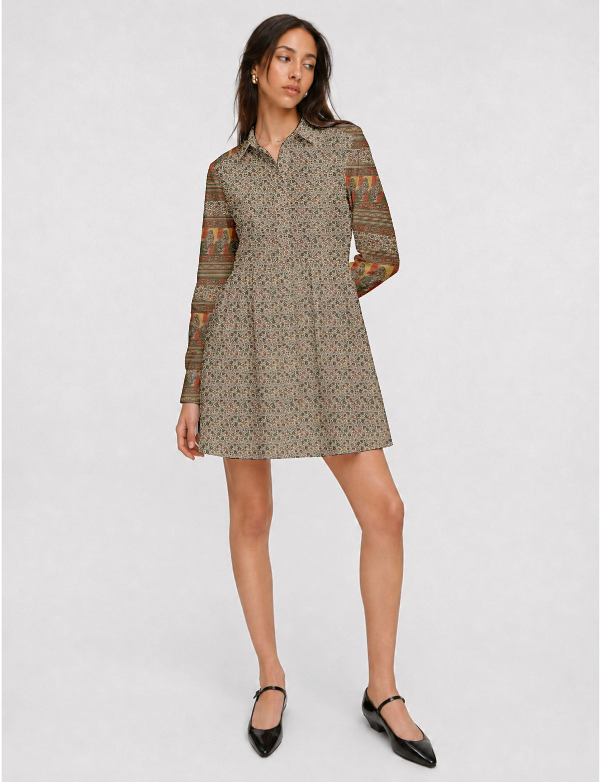 Short shirt dress with a relaxed A-line silhouette, point collar, partial button placket, gathered waist, side pockets, and full-length cuffed sleeves.